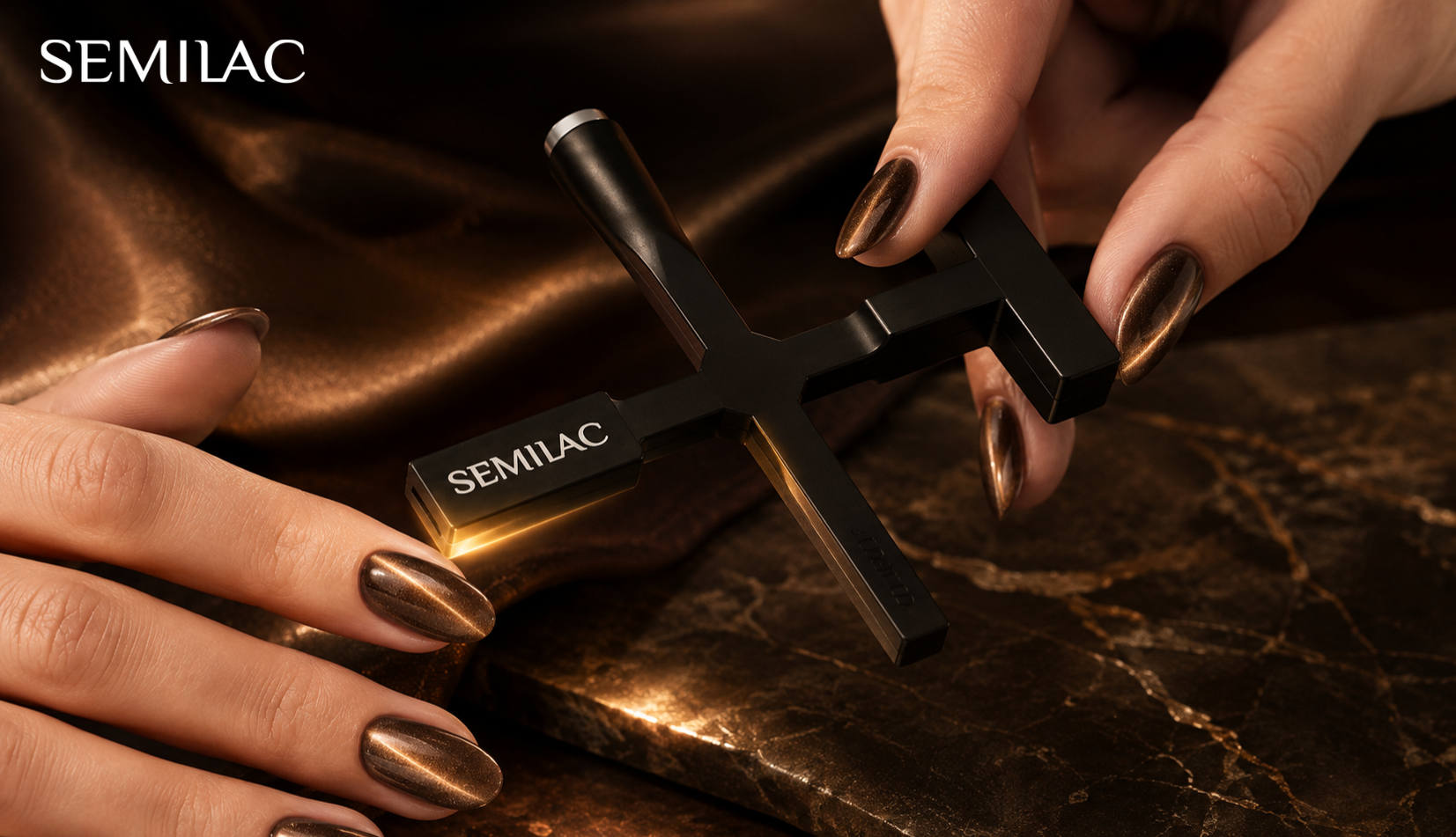 Semilac Semicopter magnetic tool held between two hands wearing bronze cat eye nails with a bright band of light across each nail