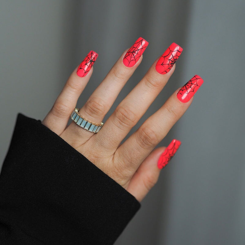 Semilac Halloween spiderweb nail art using Trick or Pink glow-in-the-dark gel polish